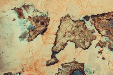 Toxic dirty water and red ground. Abstract bad ecology concept.の写真素材