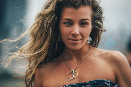 Young woman outdoors positive portraitの写真素材