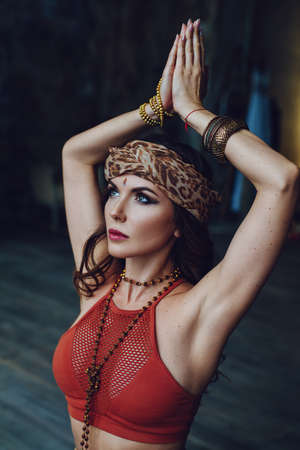 Young beautiful yogi woman in traditional clothing meditating portrait