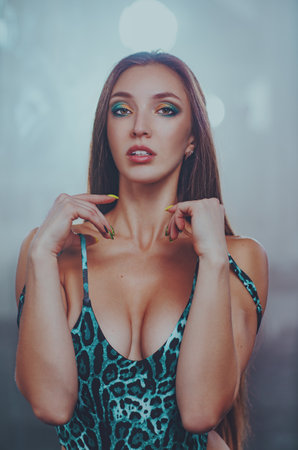 Young sexy fitness woman portrait on soft background with mirrorsの写真素材
