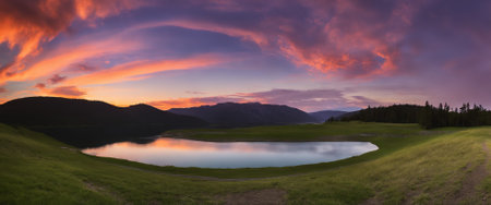 Sunset over a lake in the mountains. Landscape panorama.の素材
