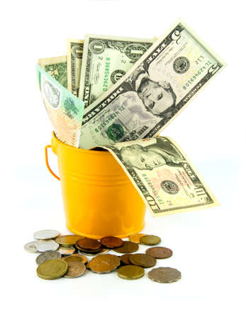 Money over flow from the bucketの写真素材