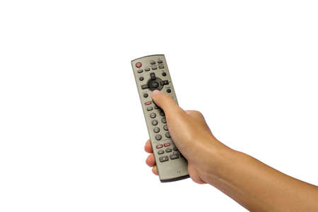 A hand holding a remote controlの写真素材