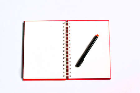 Open note book with pen, isolated on white