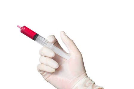 Hand holding  bloody syringeの写真素材