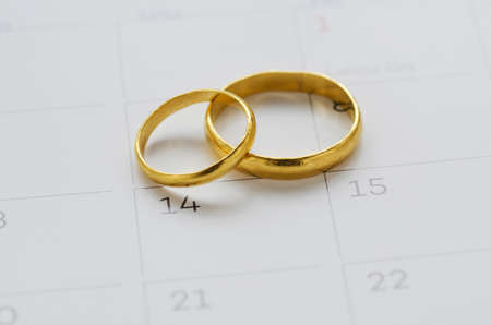 Couple of Wedding Rings on Calender symbolizing wedding date