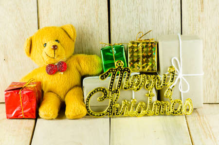 Seated teddy bear with giftの写真素材