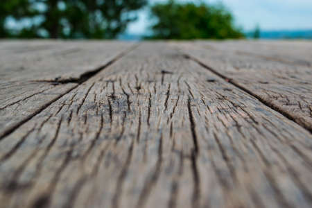 Wooden floor over a beautiful blurred natureの写真素材
