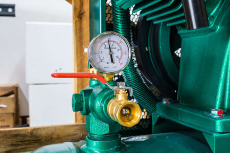 Presure gauge  gage in stall in a pressureed tank of an air pump machineの写真素材