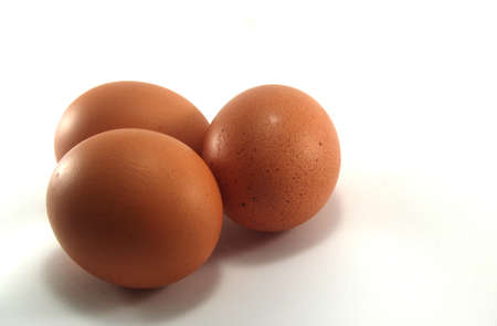 Chicken brown eggs inside for healthy on white background