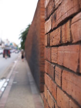 Bricks wall and street city blur background