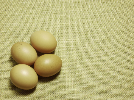 eggs on brown Hessian sackcloth woven texture background,copy space for your textsの写真素材