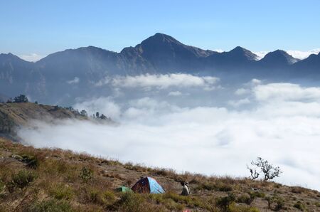 Camping with mountain background and cloudの写真素材