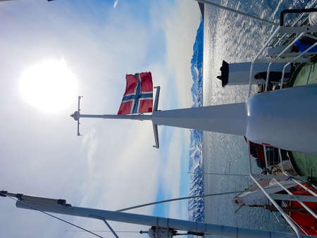 Flag of norway, Expedition on ship and boat in Svalbard norway landscape ice nature of the glacier mountains of Spitsbergen Longyearbyen Svalbard arctic ocean winter polar dayの写真素材