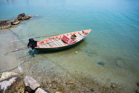 Wooden boat moored in the sea