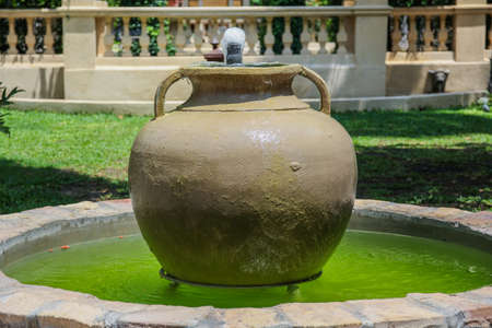 Jar fountain in natureの写真素材