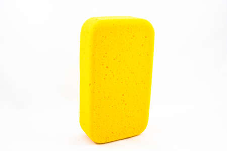 Yellow sponge isolated on White の写真素材