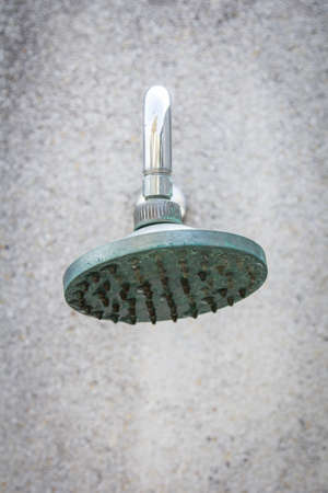 close up on head shower while running waterの写真素材