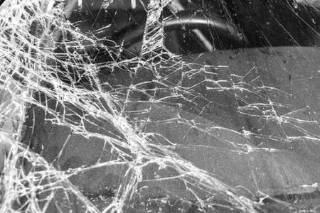 A shattered glass windscreen of a car