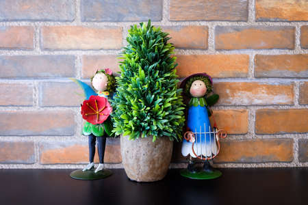 Background of a brick wall with doll stand.の写真素材