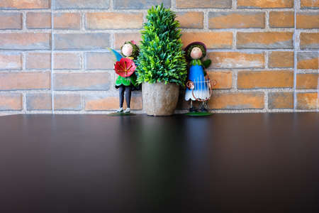 Background of a brick wall with doll stand.の写真素材