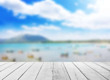 White old wood floor with Seaside fishing boats backgroundの写真素材