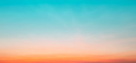 Blur pastels gradient sunset background on soft nature sunrise peaceful morning beach outdoor. heavenly mind view at a resort deck touching sunshine, sky summer clouds.の写真素材