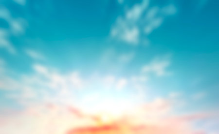 Blur pastels gradient sunset background on soft nature sunrise peaceful morning beach outdoor. heavenly mind view at a resort deck touching sunshine, sky summer clouds.の写真素材