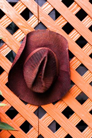 hat hanging on the wallの写真素材