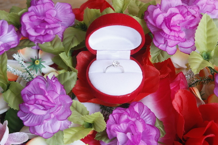 the engagement ring is among flowerの写真素材