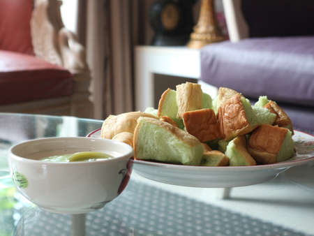Custard breads on a glass table during afternoon
