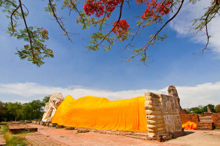 A reclining Buddha and blue skyの写真素材