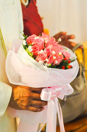 Flowers of wedding in his handの写真素材