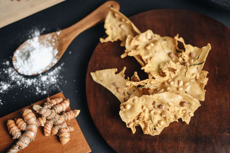 Crispy peanut crackers are an Indonesian food snack or called Peyek. Black Backgroundの写真素材
