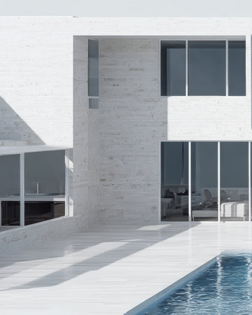 A stylish modern house features large glass windows and a clean exterior in a peaceful setting. The swimming pool reflects the sunlight, adding tranquility to the space.の素材