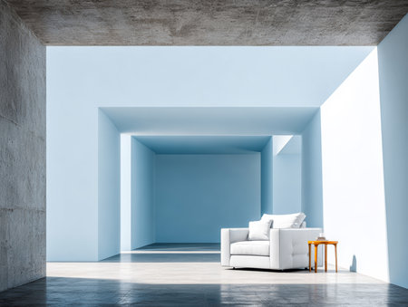 A spacious room features a white armchair placed near a small wooden table. Soft blue walls amplify the natural light, creating a calm atmosphere perfect for relaxation or reading.の素材