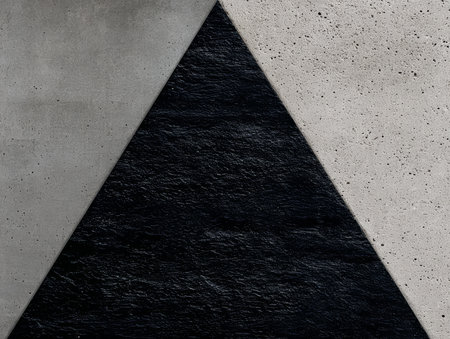 Black and gray triangular shapes meet at an angle, creating a striking contrast between rough and smooth surfaces. This modern design emphasizes simplicity and elegance.の素材