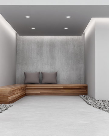 A contemporary space showcases a wooden bench against a smooth gray wall. Soft cushions add comfort, while small stones provide a natural touch. The lighting creates a serene atmosphere.の素材