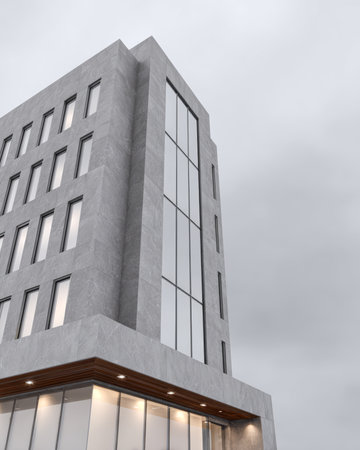 A modern building stands tall with a sleek exterior, large glass windows, and a minimalist design. The sky above is cloudy, adding an atmospheric touch to the urban landscape.の素材