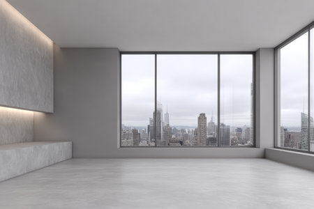 The spacious room features floor-to-ceiling windows revealing a gray, overcast skyline. The bare interior showcases minimalistic design and natural light, creating an open atmosphere.の素材
