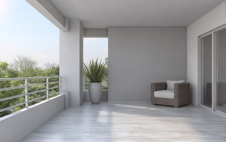 A bright balcony features modern wicker furniture and a large potted plant. The space is open and airy, with greenery visible beyond the railing, creating a serene atmosphere.の素材