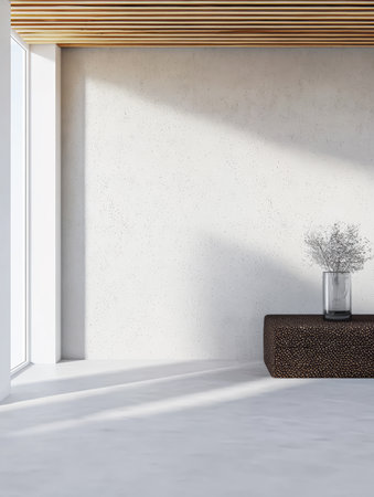 A spacious room showcases a minimalistic design with a woven brown table and a glass vase holding delicate flowers, illuminated by natural light from large windows.の素材