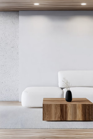 A spacious living room features a sleek white sofa and a wooden coffee table. Soft light illuminates the interior, enhancing the minimalist design. A small vase adds a touch of elegance.の素材