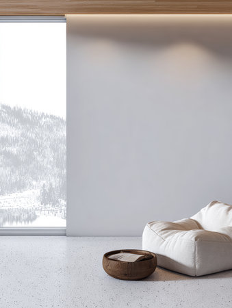 A minimalist room features a large window with a view of snowy mountains. A comfy bean bag chair and round coffee table create a warm, inviting atmosphere perfect for relaxation.の素材