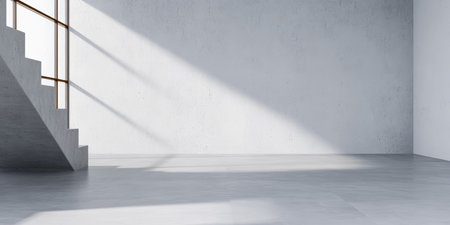 Bright and spacious room features concrete walls with a minimalist design. Stairs lead to another level, while sunlight casts shadows on the floor, showcasing simplicity and modernity.の素材