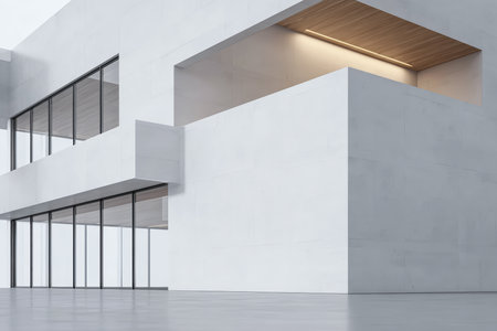 This setting features a striking modern building with smooth white walls, large glass windows, and an emphasis on simplicity and space. Natural light enhances the design.の素材