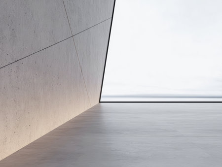 A sleek, minimalist interior showcases a sharply angled concrete wall and a skylight that floods the space with natural light, creating a tranquil atmosphere.の素材