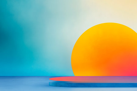 A vibrant sunset scene with a large yellow sun fading into orange, framed by a soft blue background. A round platform sits below, creating a perfect setting for art displays or photography.の素材