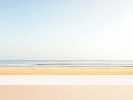 The scene captures a peaceful beach at sunset with soft waves lapping at the shore. The warm sand and calm sky create a relaxing atmosphere. Ideal for unwinding by the ocean.の素材