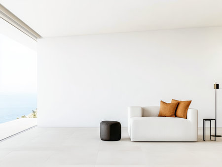 Bright living room showcases a white sofa with brown cushions and a black side table, while large windows reveal a stunning ocean view in the background.の素材